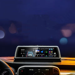 Car dashboard with a digital display showing various icons and information against a dark background.